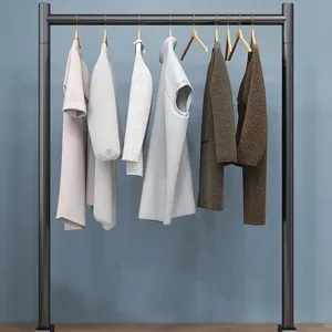 Minimalist floor-standing metal clothing rack with wooden hangers, front view for home use.