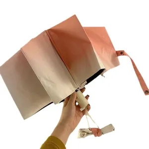 Parapluie pliant dégradé de protection UV pour femmes, design automatique soleil et pluie.
