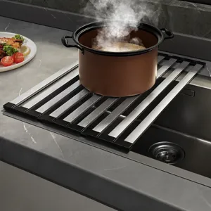 Stainless steel roll-up dish drying rack, foldable sink drainer and heat-resistant kitchen mat.