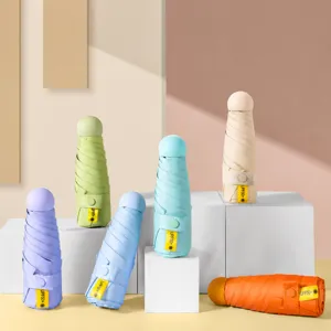 Mini parapluie solaire capsule pliable en cinq avec protection UV UPF50+ pour voyage.