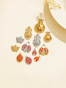 Stainless steel insect charms detail view, featuring gold silver bee and ladybug beetle pendants.