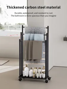 Modern black metal floor standing towel rack with bottom storage shelf for bathroom use.
