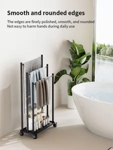 Modern metal rolling towel rack with multiple bars and storage tray for bathroom organization.