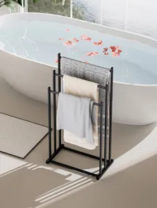 Modern black metal freestanding towel rack for bathroom, sleek and space-saving design.