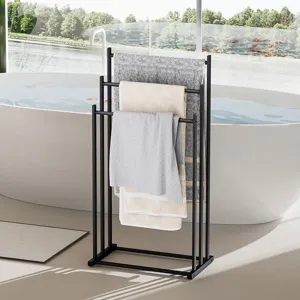 Freestanding black metal towel rack with multi-tier ladder bars for bathroom organization.