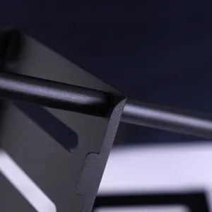 Matte black metal storage rack detail close up showing sturdy craftsmanship and fine texture.