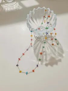 Bohemian colorful beaded chain detail, perfect for DIY summer necklaces and bracelets.