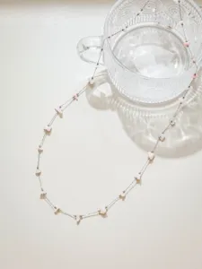 Detailweergave roestvrij staal roze steenslag kralen positionering ketting diy sieraden ophanging