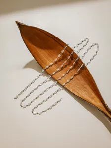 DIY crystal beaded chain with clear tubes and metal beads for jewelry making and crafting.
