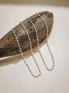 Detailed view of delicate white beaded chain for DIY jewelry making and accessories.