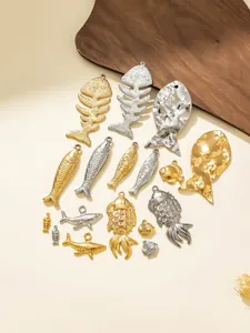 Stainless steel fish pendant DIY jewelry accessories detail, various fish shapes and hammered styles.