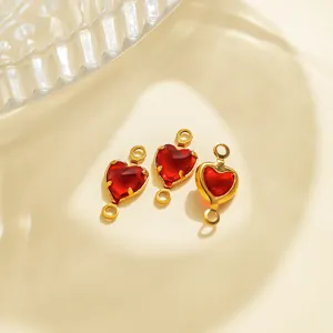 Red heart pendant detail showing gold stainless steel bezel and red stone for DIY jewelry making.