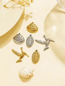 Stainless steel DIY jewelry charms set with hummingbird, religious portrait and shell pendants.