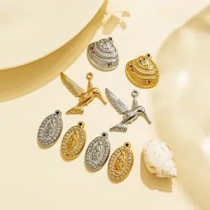 Stainless steel charms set including bird, religious portrait and shell pendants for DIY jewelry.