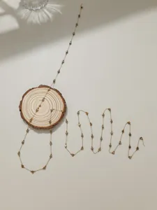 Détail de chaîne étoile en acier inoxydable, matériau de bijoux délicat pour carillons éoliens.