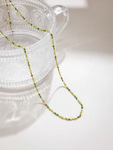 Delicate stainless steel bead chain with green and yellow candy details for DIY jewelry crafting.