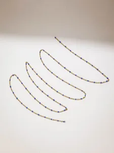 Detailed shot of gold stainless steel chain with blue beads, ideal for DIY crafts and doll clothes.