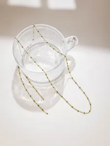 Stainless steel candy bead fine chain detail showing green accents for DIY jueley making.