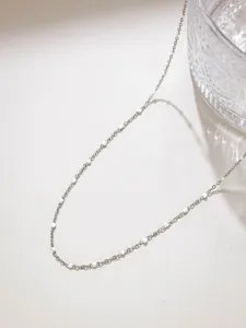 Detail view of stainless steel candy rice bead fine chain, ideal for DIY doll crafts.
