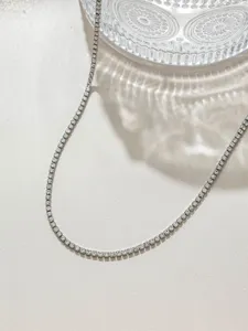 Detail of sparkling zircon rhinestone chain, ideal for DIY clothing, collars, and jewelry craft.