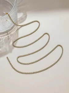 Sparkling rhinestone chain detail shot, perfect for DIY clothing, straps and jewelry crafting.