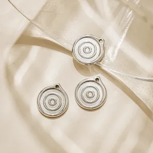 Stainless steel spiral round pendant detail shot, vintage water ripple DIY jewelry accessory.