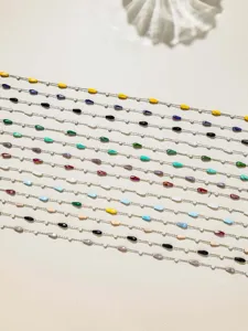 Detailed close-up of colorful teardrop bead chains, perfect for DIY jewelry making.