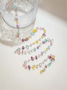 Detailed view of colorful irregular crystal stone chip chain DIY jewelry accessory material.