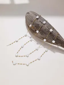 Close-up view of golden chain with irregular faux pearls, ideal for handmade DIY jewelry design.