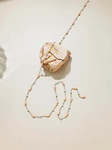 Detail view of colorful teardrop and seed bead chain for DIY jewelry making, ins style.