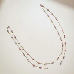 Long gold tone chain necklace with purple small square beads fashion jewelry main view