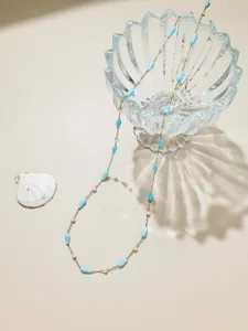 Detailed view of blue teardrop beads and pearl chain, 1-meter DIY jewelry making material.