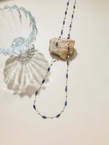 DIY beaded chain jewelry making material with blue teardrop beads and white pearls.