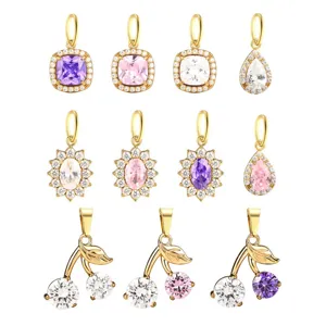 Detailed view of colorful cubic zirconia sunflower and cherry charms for DIY jewelry making.