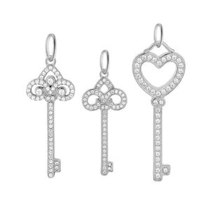 Stainless steel rhinestone key pendant set featuring heart and ornate designs for DIY jewelry.