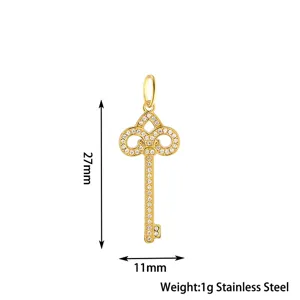Detailed view of the gold stainless steel key pendant featuring pave crystal rhinestones.