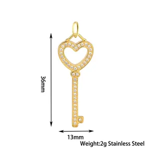Close-up details of the crystal-encrusted heart key pendant showcasing exquisite metal craftsmanship.