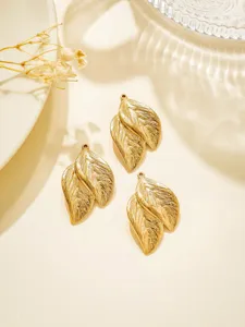 Close-up of gold stainless steel leaf pendant details for DIY jewelry accessories.