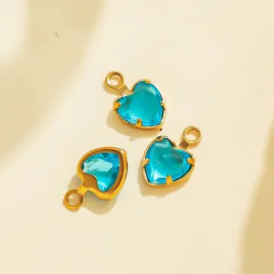 Detailed view of blue heart crystal stainless steel bezel DIY jewelry charm pendant piece.