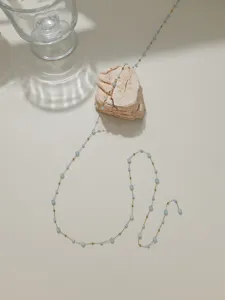 Detail view of crystal beaded chain, blue and gold semi-finished DIY jewelry making material.