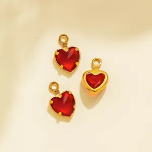 Detailed close-up of red heart pendant charm, gold stainless steel bezel DIY jewelry accessory.