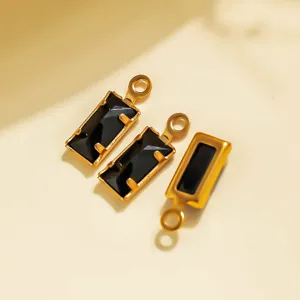 Detailed shot of rectangular black gemstone stainless steel DIY pendants for jewelry making.