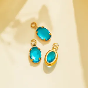 Detail shot of vintage oval blue gemstone stainless steel pendants for DIY jewelry design.