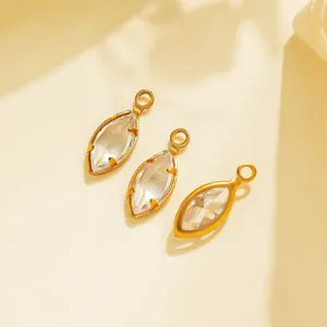 Detailed shot of gold-rimmed marquise crystal jewelry pendants for DIY crafts and necklaces.