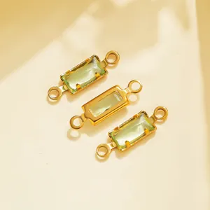 Close-up detail of vintage gold-tone stainless steel rectangle green gemstone DIY connectors.