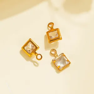 Close-up of gold stainless steel square crystal pendant charms for DIY jewelry making accessories.