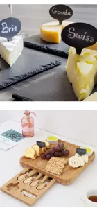 Bamboo charcuterie board set with pull-out drawer and slate plates for cheese serving.