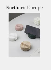 Natural marble phone stand, minimalist Nordic style desk holder for smartphone and tablet.