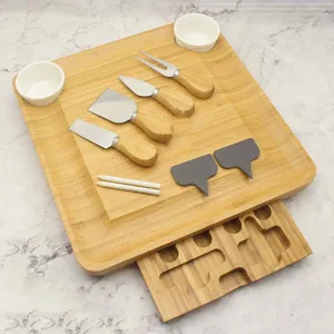 Bamboo cheese board set with knives ceramic bowls and slate labels for kitchen parties