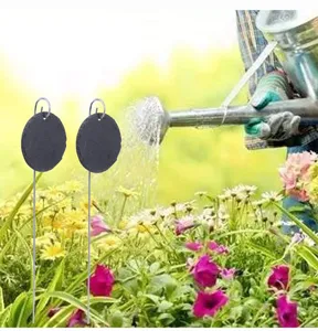 Natural slate plant labels with metal stakes, round garden markers for flowers and herbs.